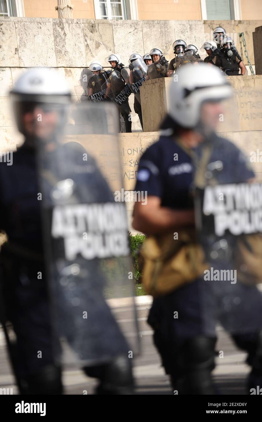 Greek riot policemen clash with protestors front the parliament in Athens, Greece on May 6, 2010. Riots broke out across the Greek capital during a massive protest against drastic austerity measures introduced to secure rescue loans for the country's near-bankrupt economy. Photo by Mousse/ABACAPRESS.COM Stock Photo