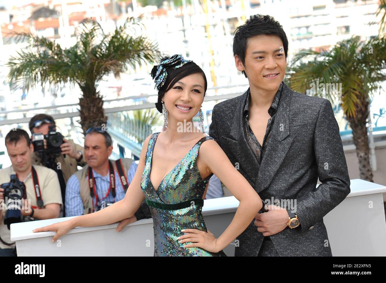 'Chinese actress Li Feier and Chinese actor Zi Yi pose during the photocall of the film ''Rizhao Chongqing'' (Chongqing Blues) presented in competiton at the 63rd Cannes Film Festival in Cannes, France on May 13, 2010. Photo by Hahn-Nebinger-Orban/ABACAPRESS.COM' Stock Photo