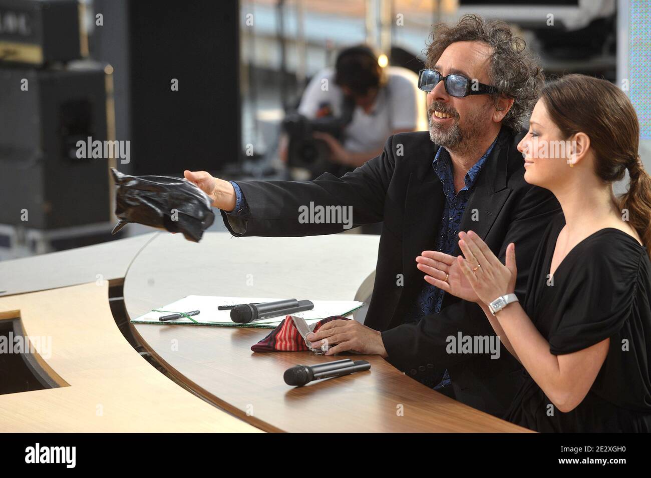 Tim Burton and Giovanna Mezzogiorno during the broadcasting of 'Le Grand  Journal' TV show on Canal Plus channel on the Martinez beach during the  63rd Cannes Film Festival in Cannes, France on