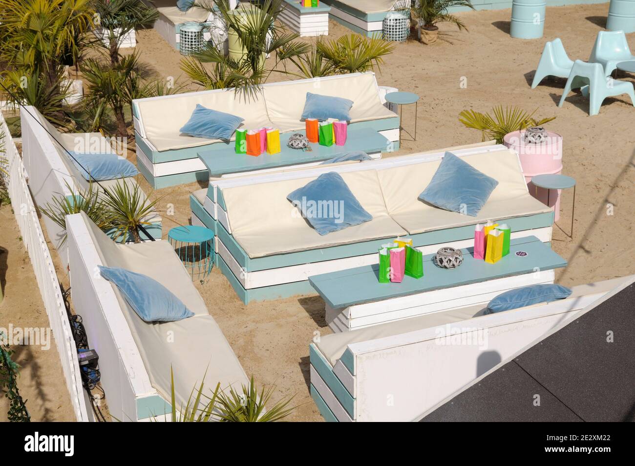 Beach club with contemporary outdoor seating in white and pastel blue, Fulham Beach Club, London, England, UK Stock Photo