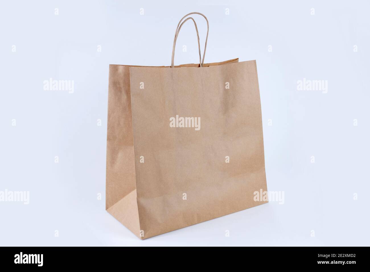 Recycled paper shopping bag on white background Stock Photo