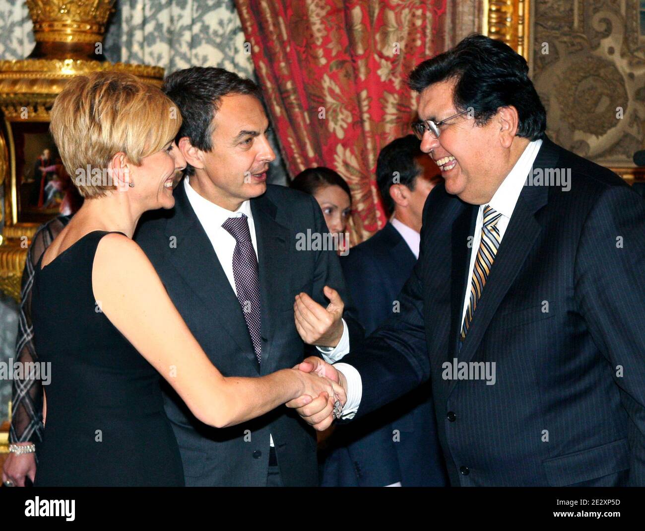 President of Peru, Alan Garcia (R) shakes hands with Sonsoles Espinosa as her husband Spanish Prime Minister Jose Luis Rodriguez Zapatero looks on at the gala dinner for European Union and Latin America summit leaders at the Royal Palace in Madrid, Spain on May 17, 2010. This was the first time Prince Felipe replaced his father King Juan Carlos as host of an official dinner at the Royal Palace. The King is still convalescent of last week's operation. Photo by Almagro/ABACAPRESS.COM Stock Photo