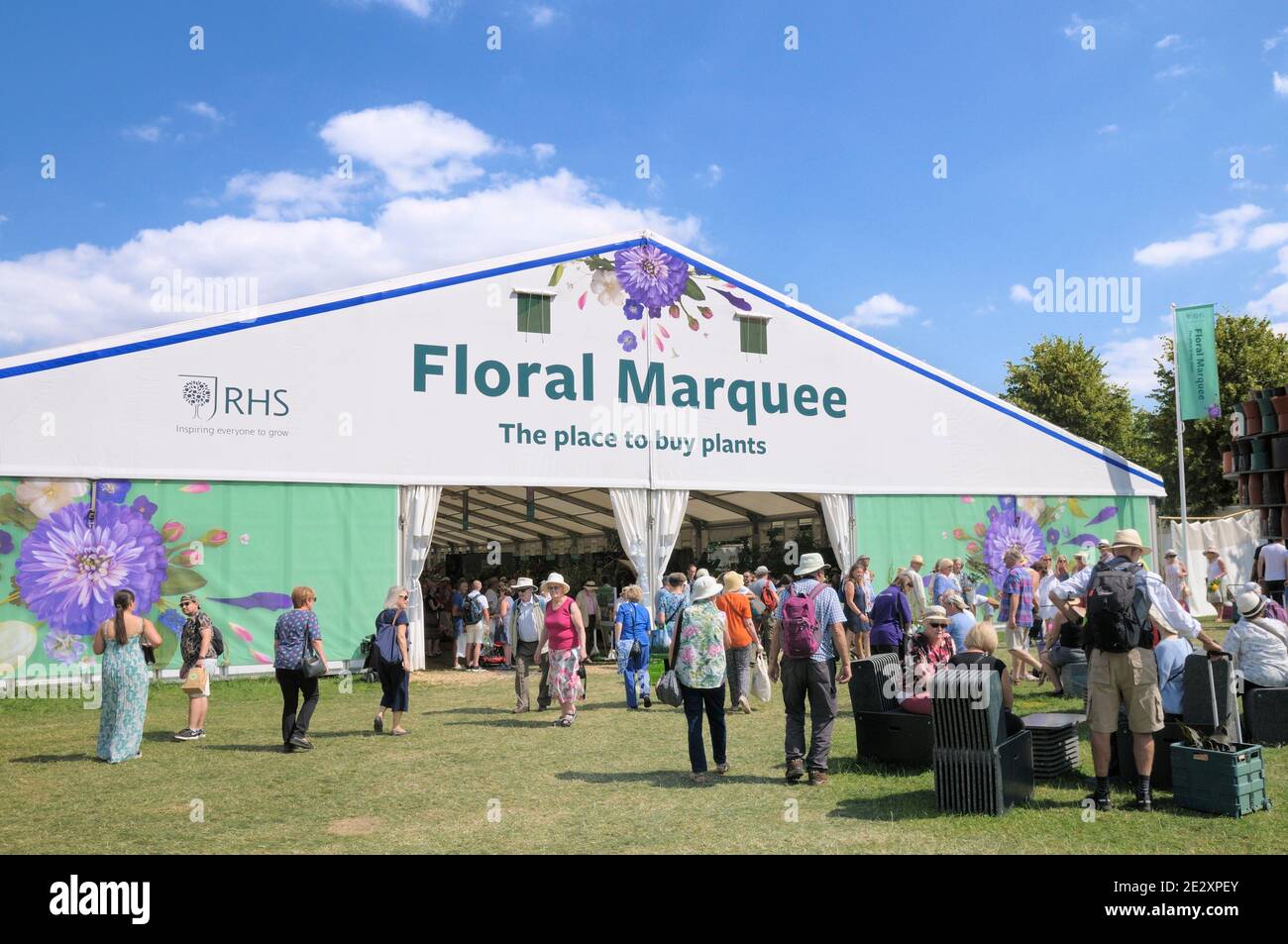 People visiting the huge Floral Marquee at RHS Hampton Court Palace Garden Festival (formerly Hampton Court Flower Show), East Molesey, Surrey, UK Stock Photo