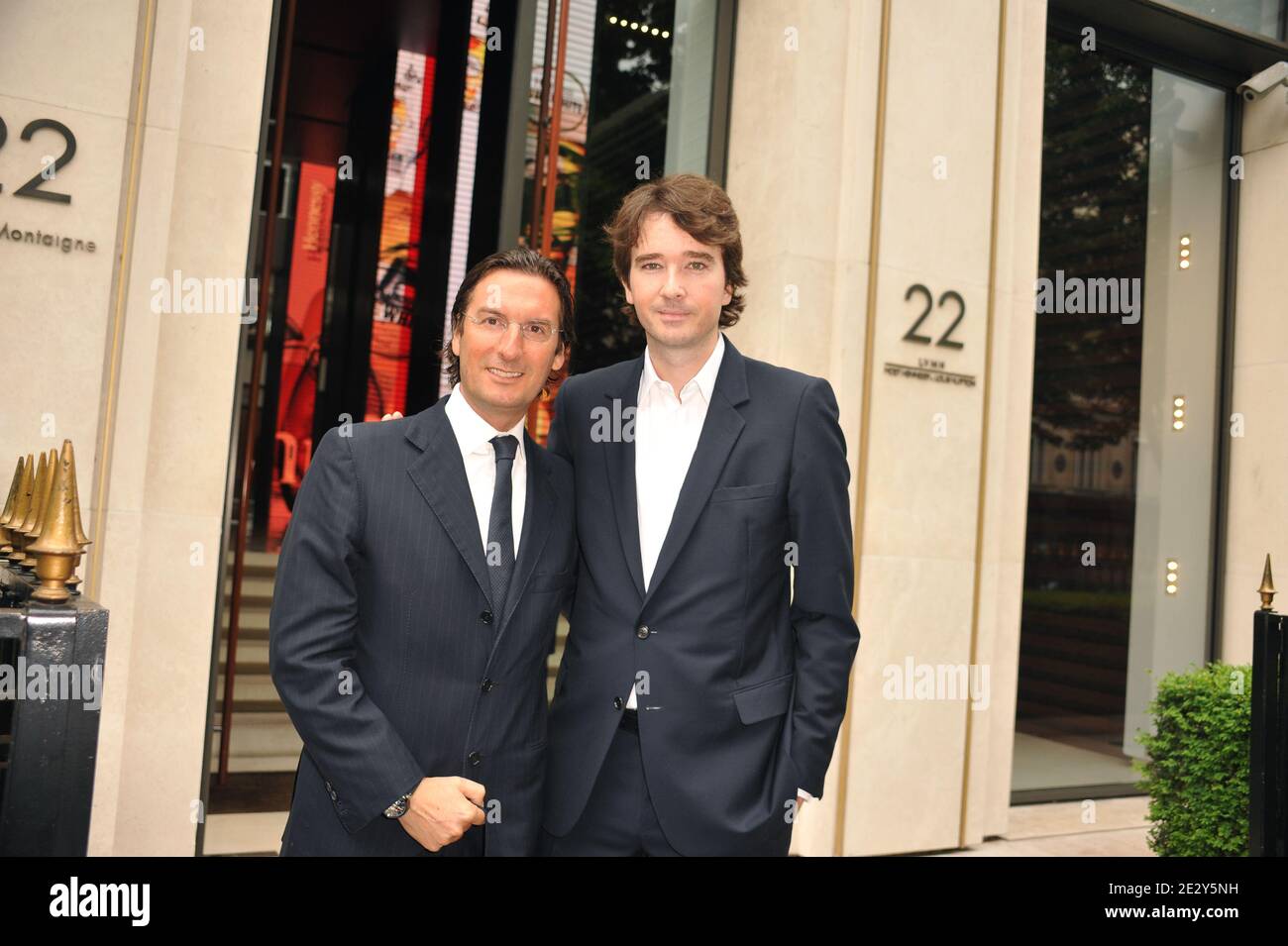 Louis Vuitton vice-president Pietro Beccari (L) and LVMH Communication  Director, Antoine Arnaultpose outside the Louis Vuitton headquarters  following a press presentation of the travel case made by Louis Vuitton to  carry the