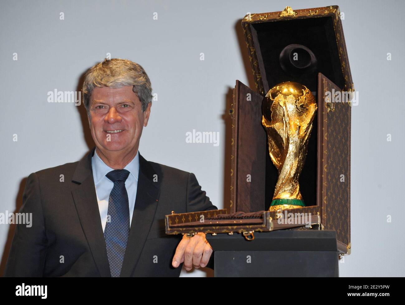 Louis Vuitton President Yves Carcelle poses next to the travel case made by Louis  Vuitton to carry the FIFA World Cup Trophy containing a replica during a  press presentation held at the