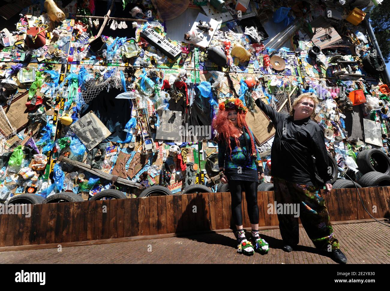 German action artist HA Schult and his wife Elke Koska present the first hotel made of trash in the world opened next to Castel SantÍAngelo in Rome,Italy on June 4, 2010. The 'Corona Save the beach Hotel', is a hotel that has been built entirely from beach garbage.It has been conceptualized and designed by HA Schult, the German action artist, famous for his work ïTrash MenÍ-in which thousands of life-sized human figures were made entirely of non-organic waste and were placed in emblematic places all around the world- the hotel will stay open until the 6th of June and for 3 days it will remind Stock Photo