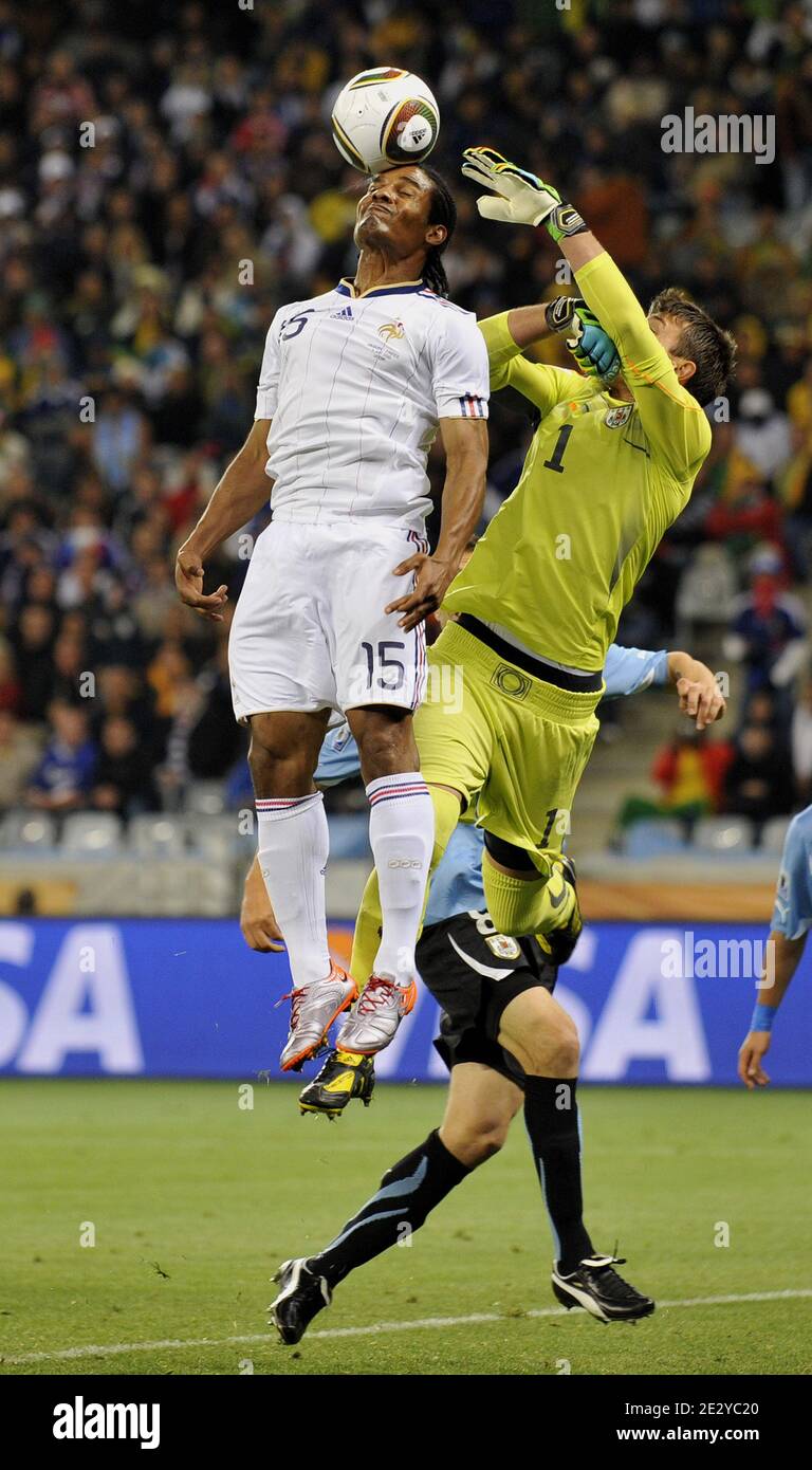 France's Florent Malouda heads the ball in front of Uruguay's goal keeper Fernando Muslera during the FIFA World Cup soccer match, France (France national football team) vs Uruguay in Capetown, South Africa, on June 11, 2010. The match ended in a 0-0 draw. Photo by Christophe Guibbaud/Cameleon/ABACAPRESS.COM Stock Photo