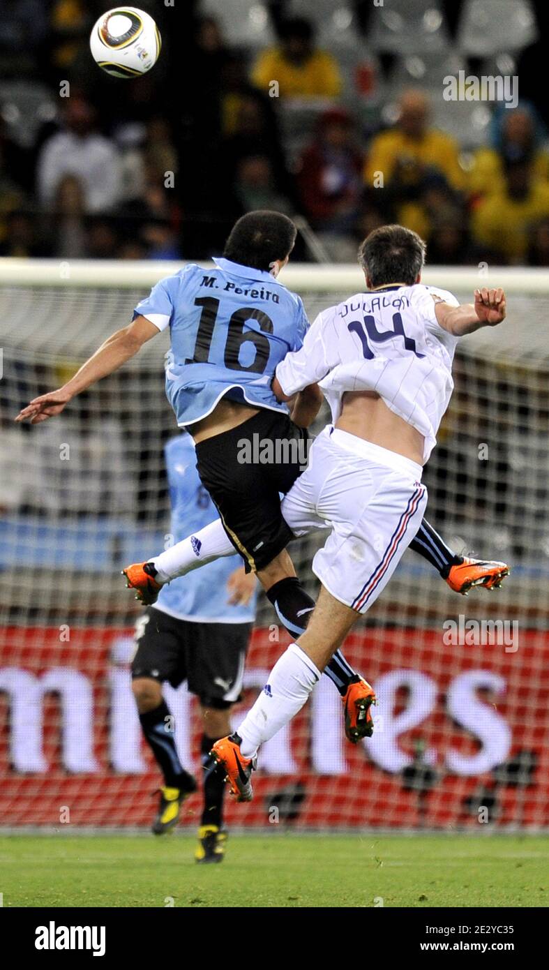 France's Jeremy Toulalan and Uruguay's Maxi Pereira battle for the ball in air during the FIFA World Cup soccer match, France (France national football team) vs Uruguay in Capetown, South Africa, on June 11, 2010. The match ended in a 0-0 draw. Photo by Christophe Guibbaud/Cameleon/ABACAPRESS.COM Stock Photo