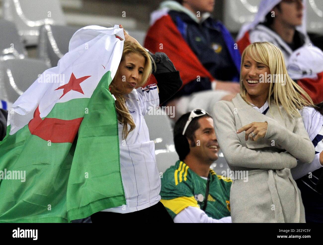 French national football team players' wives, France's striker Franck Ribery's wife Wahiba wears an Algerian flag and unidentified woman during the FIFA World Cup soccer match, France vs Uruguay in Capetown, South Africa, on June 11, 2010. France 0-Uruguay 0. Photo by Christophe Guibbaud/Cameleon/ABACAPRESS.COM Stock Photo