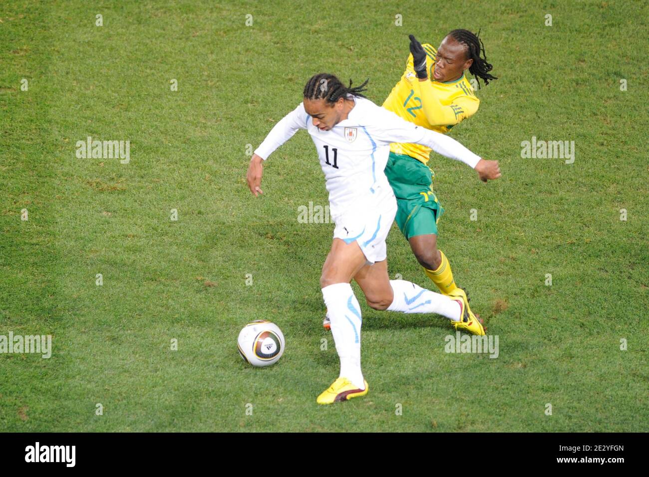 Uruguay's Alvaro Pereira battles for the ball with South Africa's Reneilwe Letsholonyane during the 2010 FIFA World Cup South Africa Soccer match, group A, South Africa vs Uruguay at Loftus Versfeld football stadium in Pretoria, South Africa on June 16, 2010. Uruguay won 3-0. Photo by Henri Szwarc/ABACAPRESS.COM Stock Photo