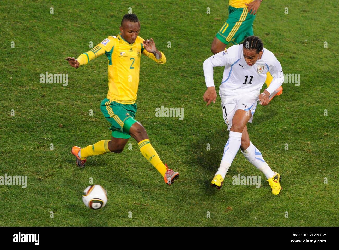 Uruguay's Alvaro Pereira battles for the ball with South Africa's Siboniso Gaxa during the 2010 FIFA World Cup South Africa Soccer match, group A, South Africa vs Uruguay at Loftus Versfeld football stadium in Pretoria, South Africa on June 16, 2010. Uruguay won 3-0. Photo by Henri Szwarc/ABACAPRESS.COM Stock Photo