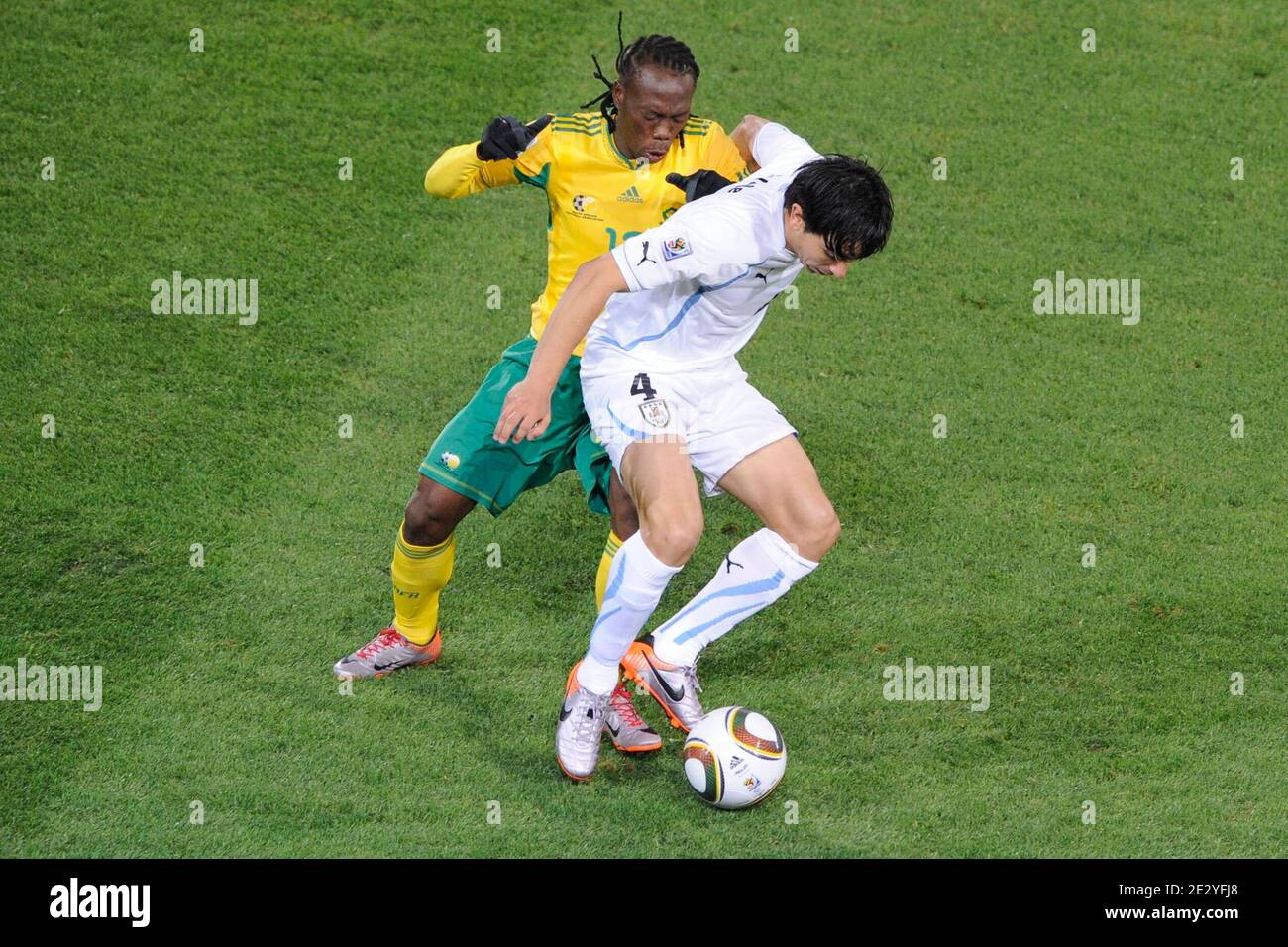 Uruguay's Jorge Fucile battles for the ball with South Africa's Reneilwe Letsholonyane during the 2010 FIFA World Cup South Africa Soccer match, group A, South Africa vs Uruguay at Loftus Versfeld football stadium in Pretoria, South Africa on June 16, 2010. Uruguay won 3-0. Photo by Henri Szwarc/ABACAPRESS.COM Stock Photo