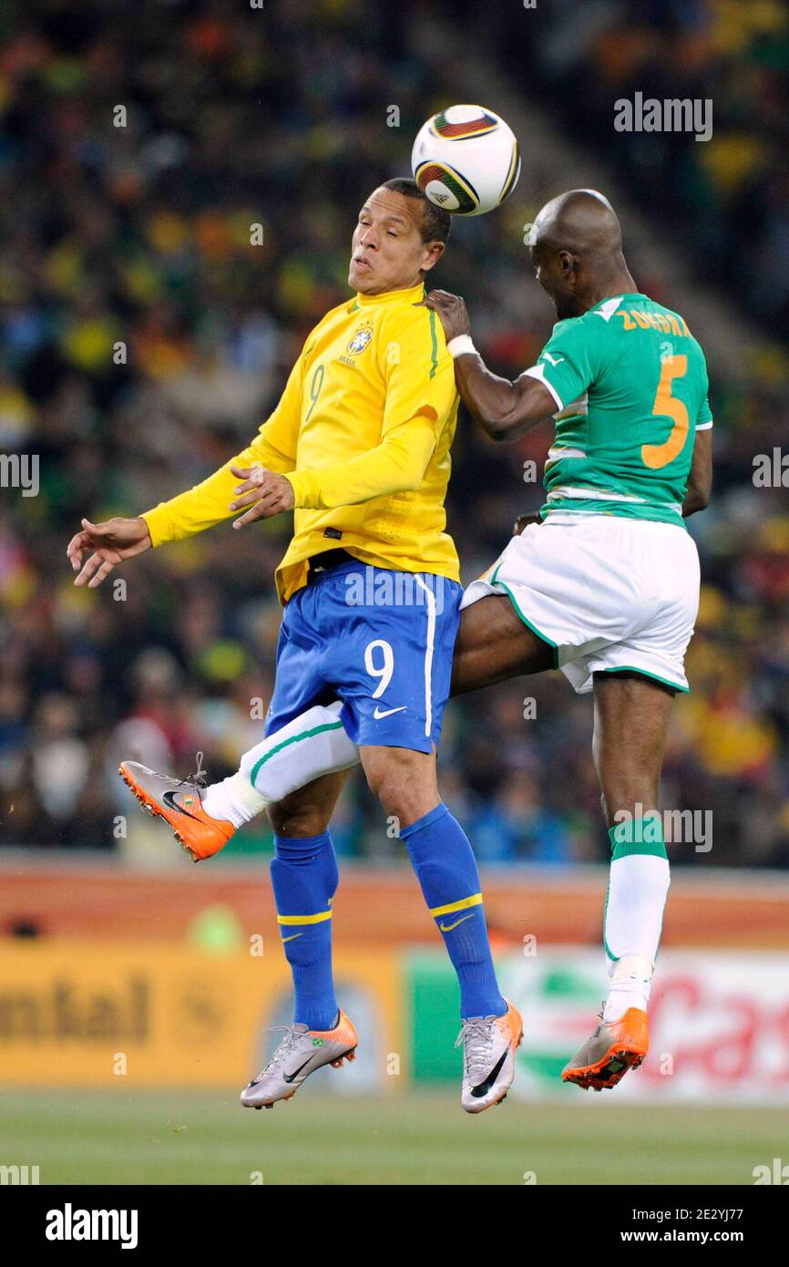 Brazil's Luis Fabiano battles Ivory Coast's Didier Zokora during the 2010 FIFA World Cup South Africa Soccer match, group G, Brazil vs Ivory Coast at Soccer City football stadium in Johannesburg, South Africa on June 20, 2010. Brazil won 3-1. Photo by Henri Szwarc/ABACAPRESS.COM Stock Photo