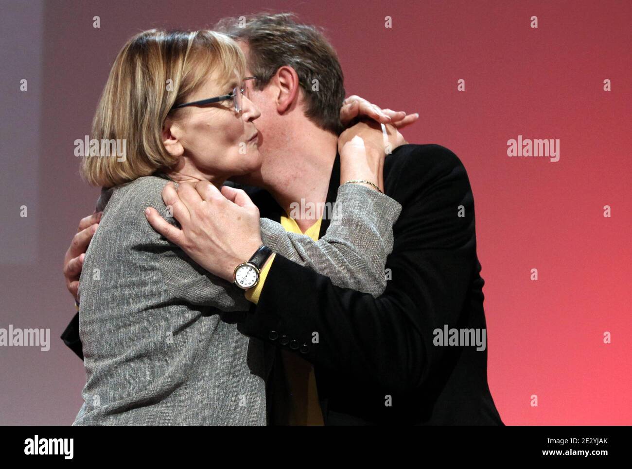 General secretary of french communist party, Marie-George Buffet  congratulates newly appointed general secretary of french communist party,  Pierre Laurent during the 35th congress of their party, in the business  district of La