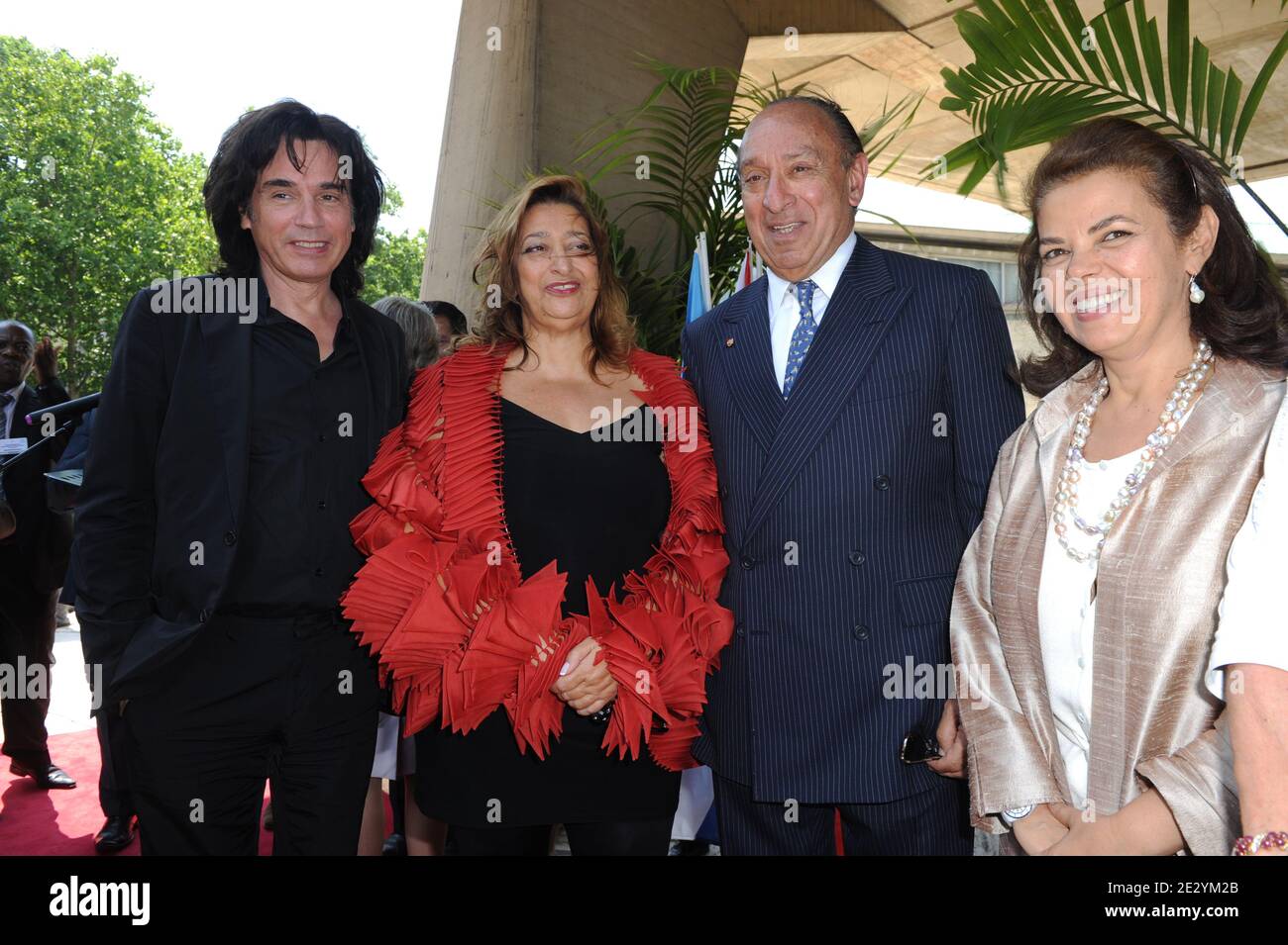 French musician Jean-Michel Jarre congratulates Iraqi-born British architect  Zaha Hadid (2nd from L) as she is named UNESCO Artist for Peace in a  ceremony at UNESCO (United Nations Education Sciences and Culture