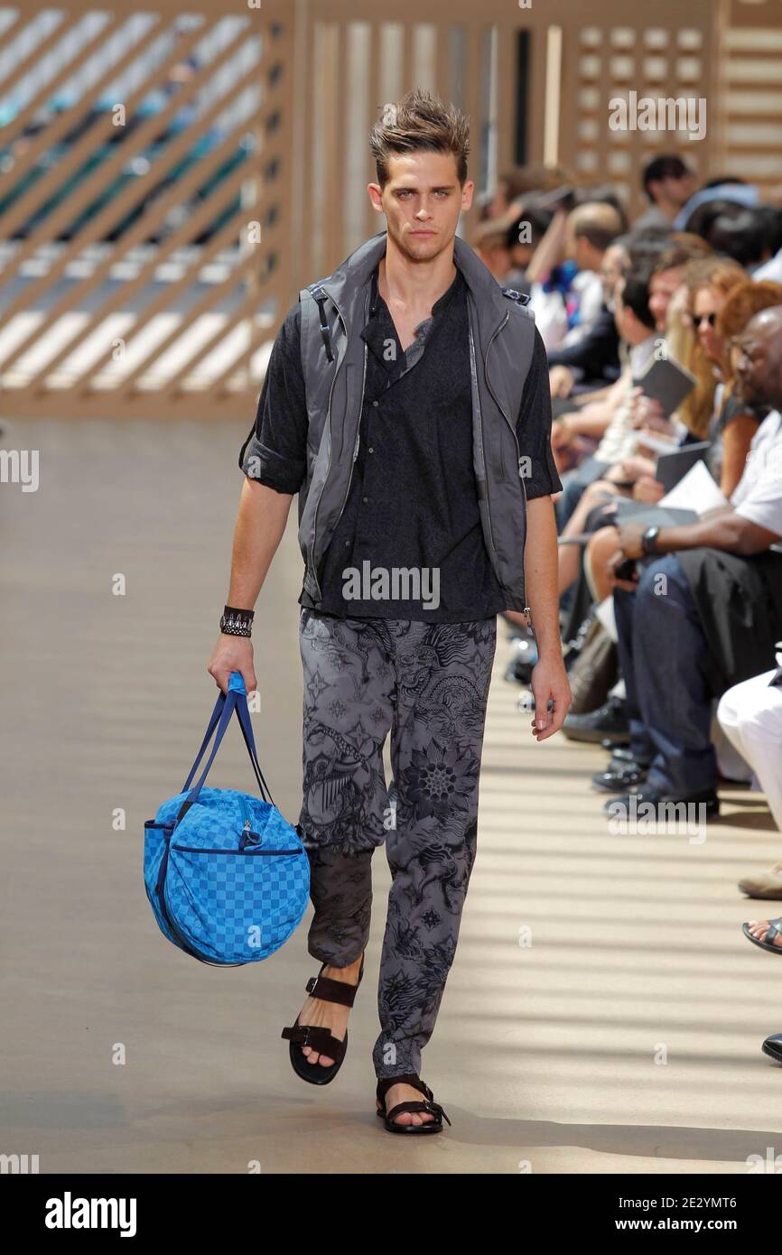A model wears a creation of Louis Vuitton Men's fashion Spring