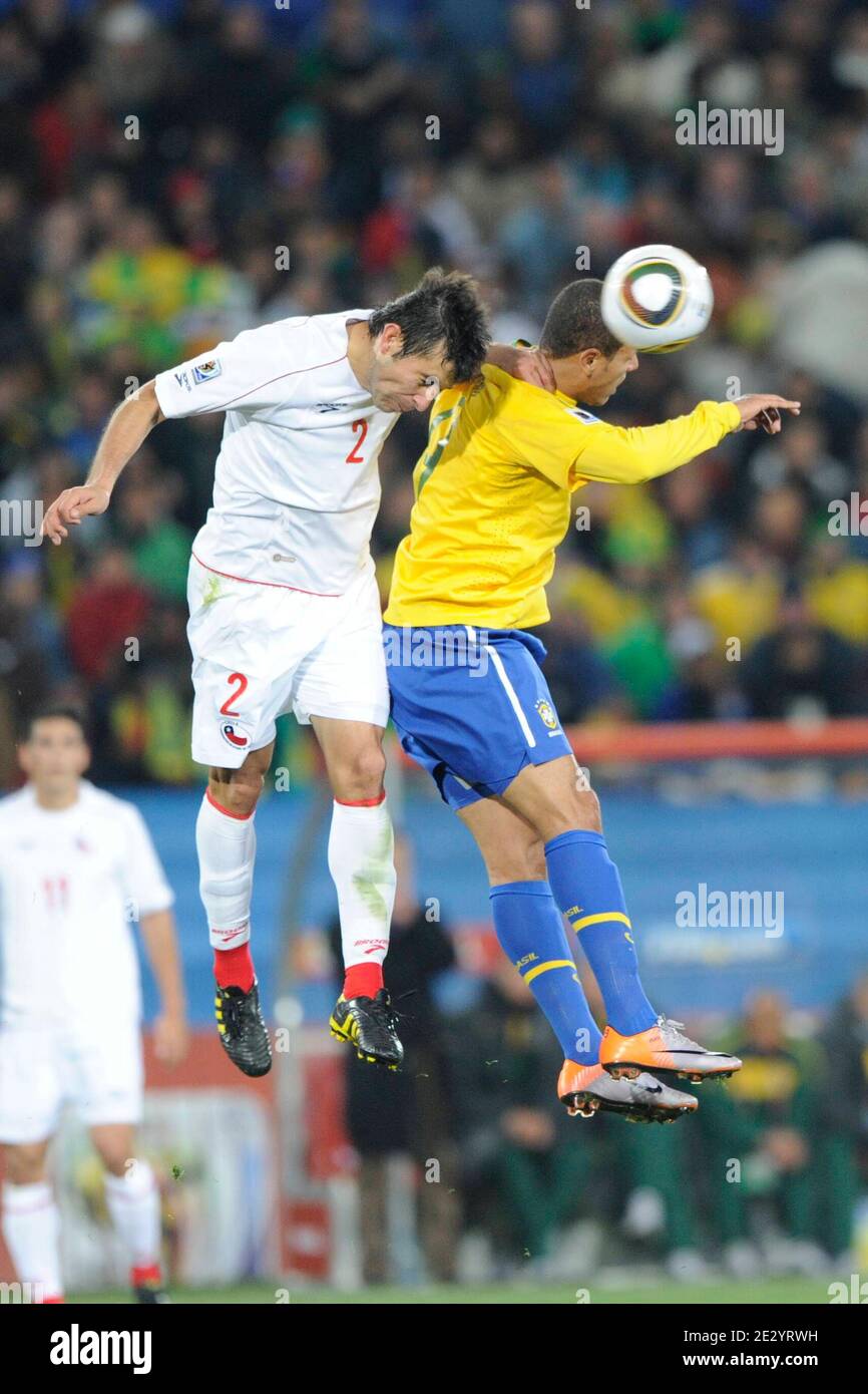 Brazil's Luis Fabiano battles Chile's Ismael Fuentes during the 2010 FIFA World Cup South Africa 1/8 of final Soccer match, Brazil vs Chile at Ellis Park football stadium in Johannesburg, South Africa on June 28, 2010. Brazil won 3-0. Photo by Henri Szwarc/Cameleon/ABACAPRESS.COM Stock Photo