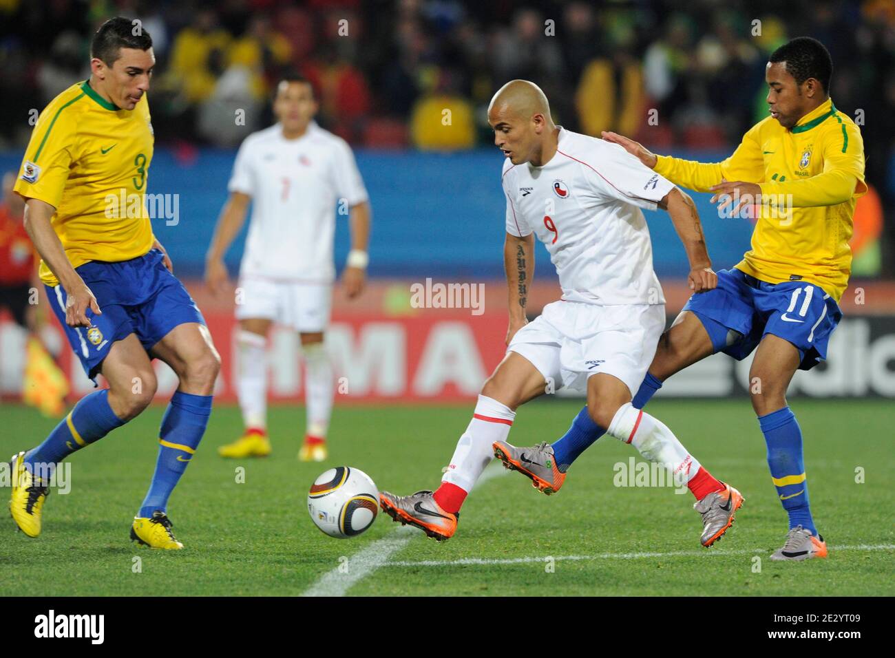 Brazil's Lucio and Robinho battles Chile's Humberto Suazo during the 2010  FIFA World Cup South Africa 1/8 of final Soccer match, Brazil vs Chile at  Ellis Park football stadium in Johannesburg, South