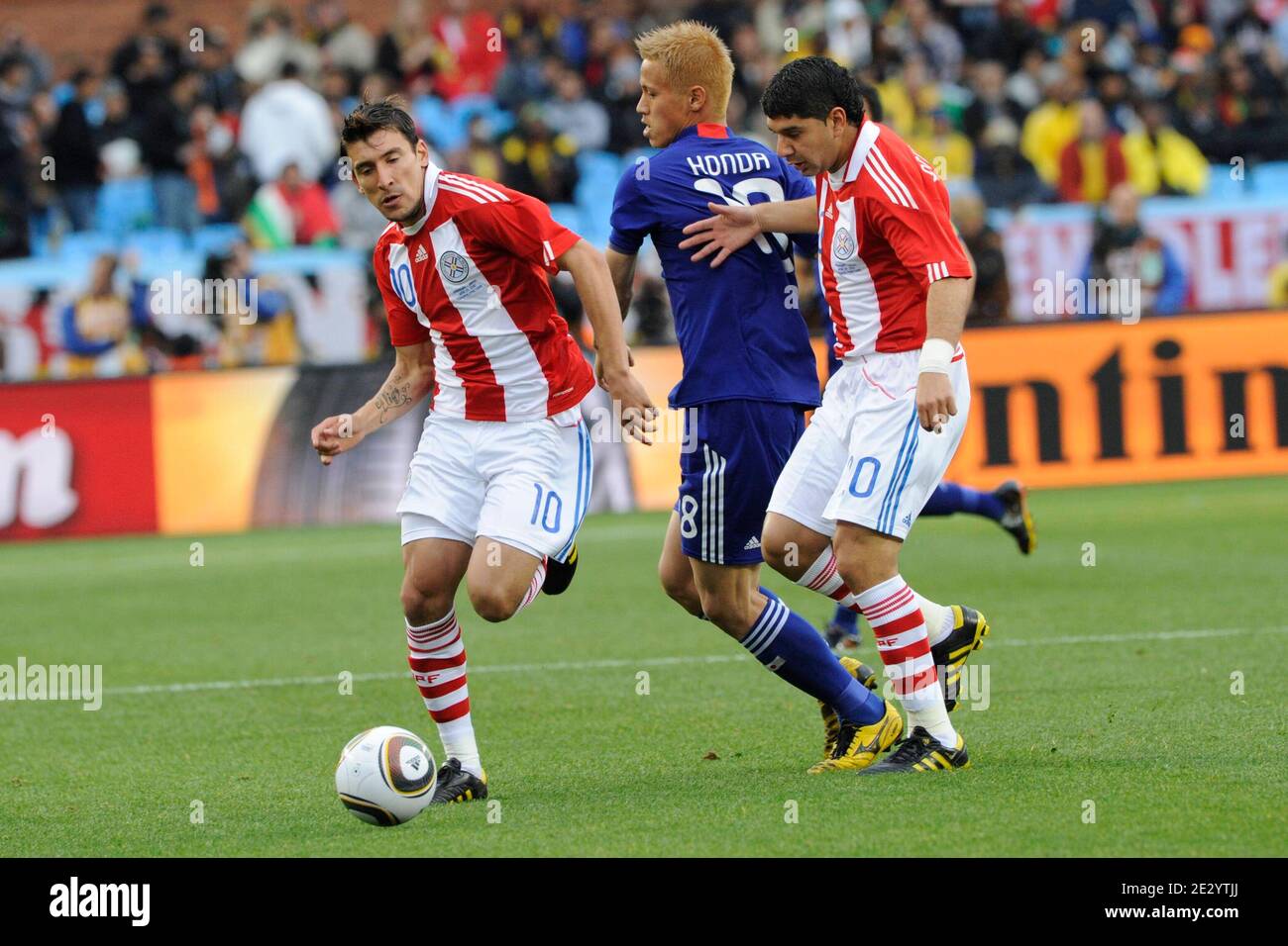 Paraguay's Edgar Benitez and Mestor Ortigoza fight for the ball Japan's Keisuke Honda during the 2010 FIFA World Cup South Africa 1/8 of final Soccer match, Paraguay vs Japan at Loftus Versfeld football stadium in Pretoria, South Africa on June 29, 2010. Paraguay won 0-0 (5p to 3 after penalties). Photo by Henri Szwarc/ABACAPRESS.COM Stock Photo