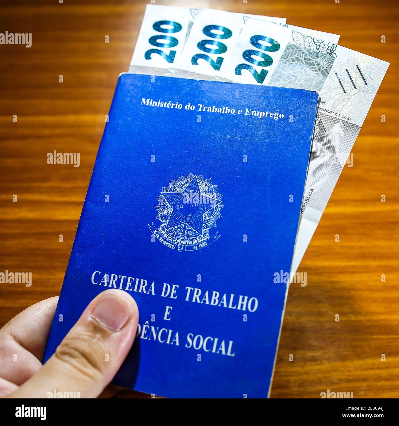 Sorocaba, Brazil. 15th Jan, 2021. Work card and three 200 reais bills. With  the end of the emergency aid of 600 reais in January 2021, about 48 million  Brazilians were impacted. Approximately