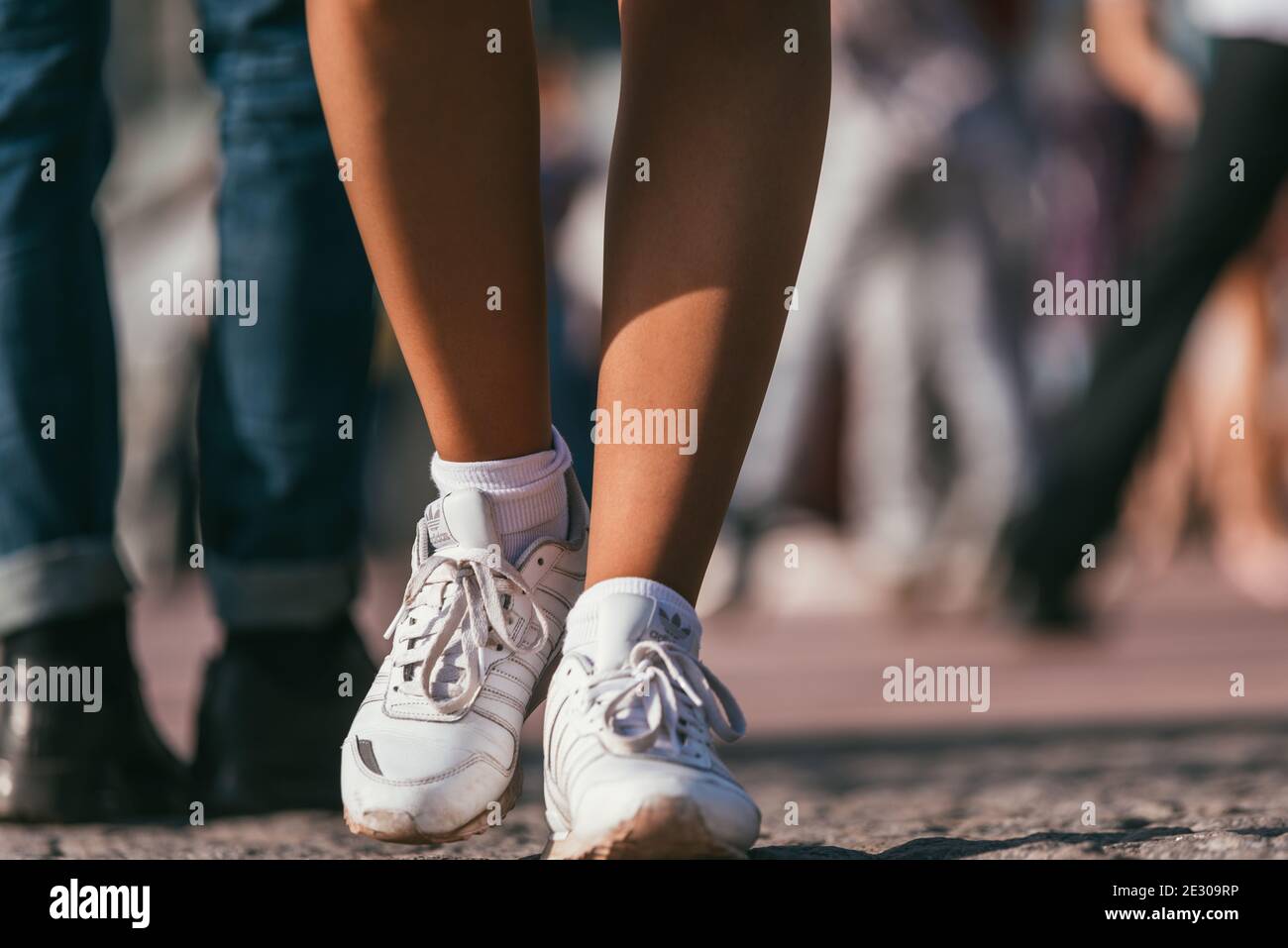 MOSCOW, RUSSIA-MAY 09, 2015: people are dancing outdoors in the Park on  Pushkinskaya embankment at sunny day. White adidas sneakers on women's feet  in Stock Photo - Alamy