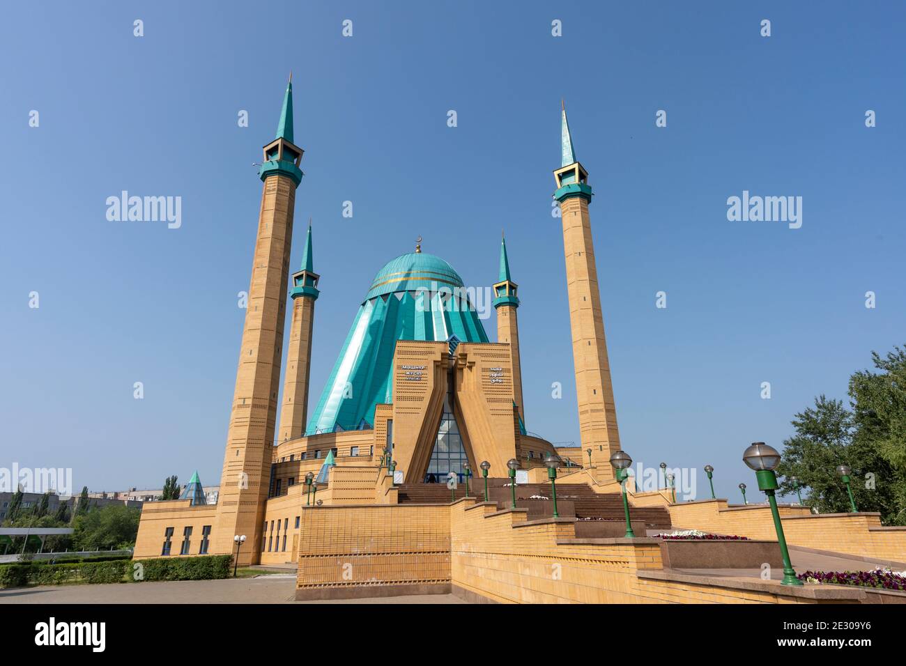 Pavlodar, Kazakhstan - July 27, 2020: the entrance of the Mashkhur Jusup Mosque with four minarets and blue roof. Stock Photo