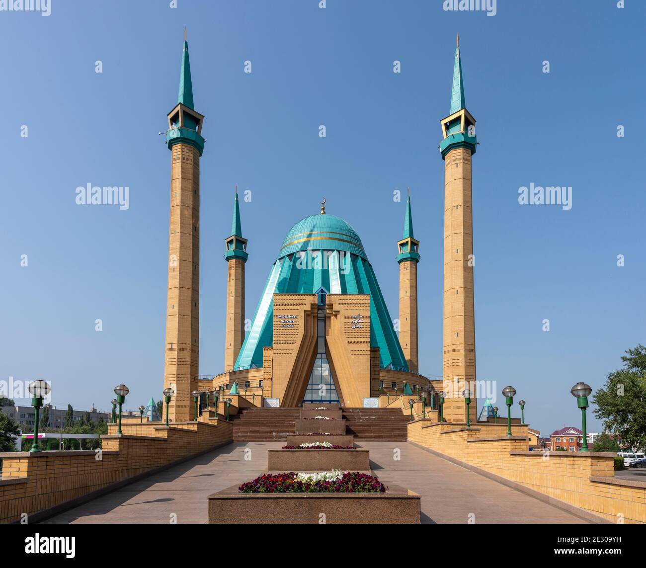 Pavlodar, Kazakhstan - July 27, 2020: the entrance of the Mashkhur Jusup Mosque with four minarets and blue roof. Stock Photo