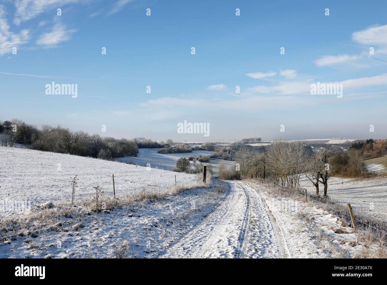 Winter landscape with snowy fields under a blue sky Stock Photo - Alamy