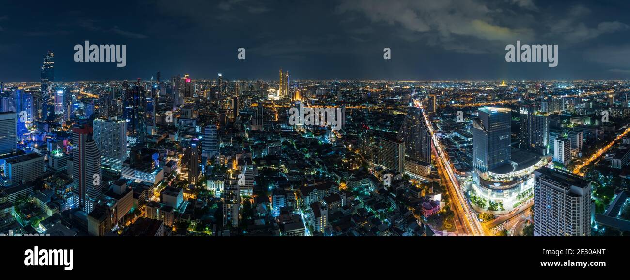 Bangkok business district cityscape with skyscraper at twilight, Thailand - Panorama Stock Photo