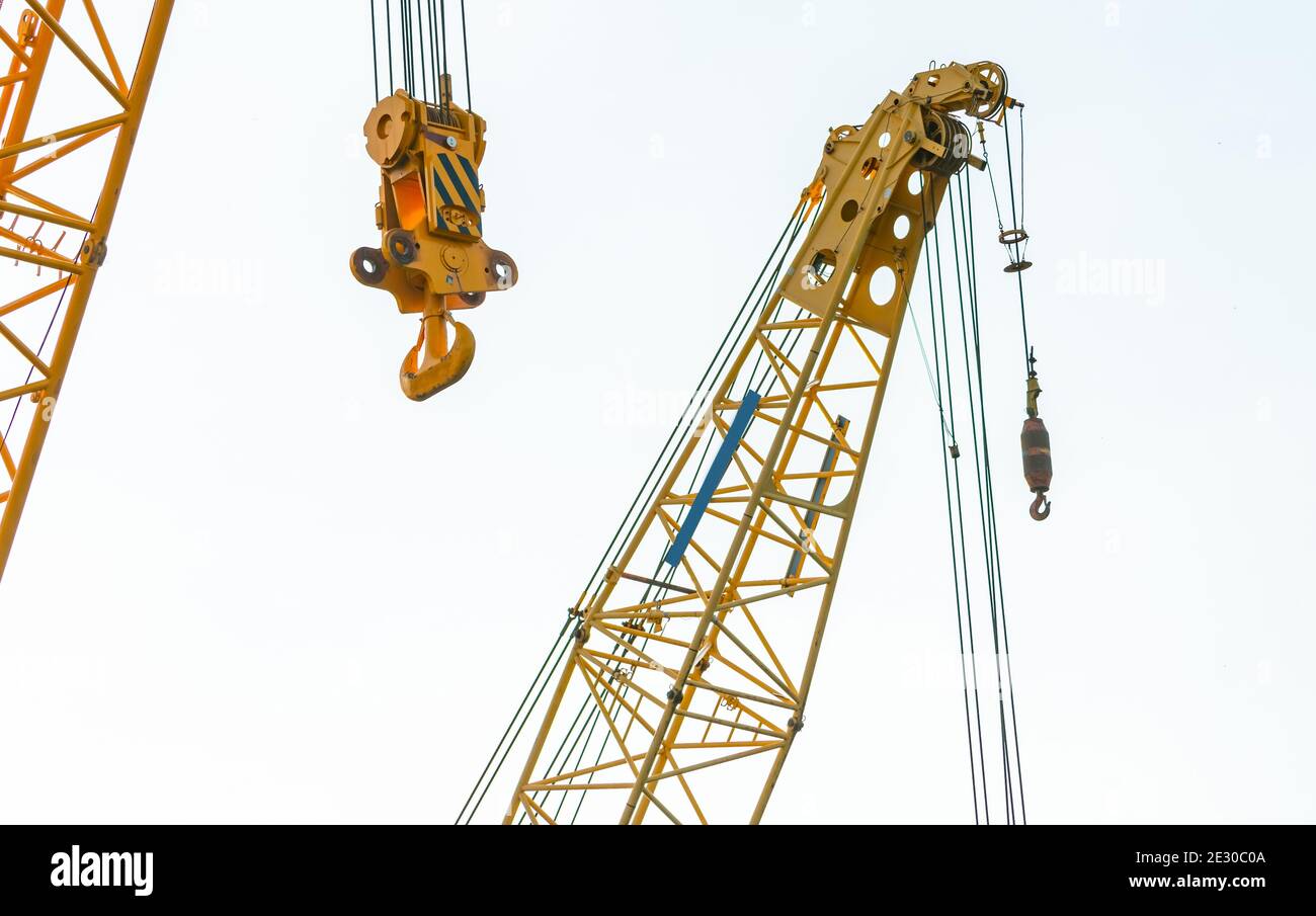 Crawler crane isolated on white background. Real estate industry