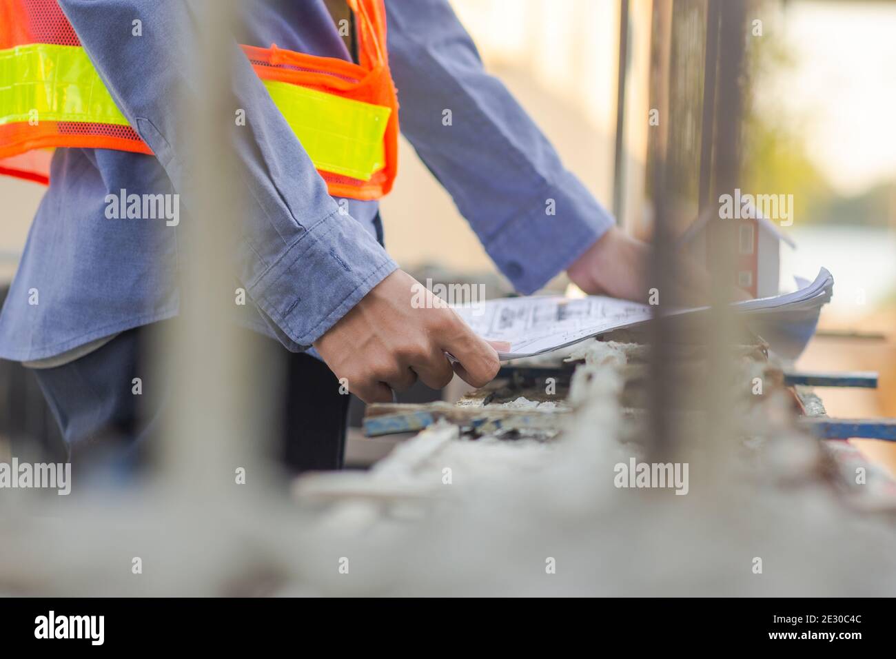 Engineer inspection on site building construction with blueprint Stock