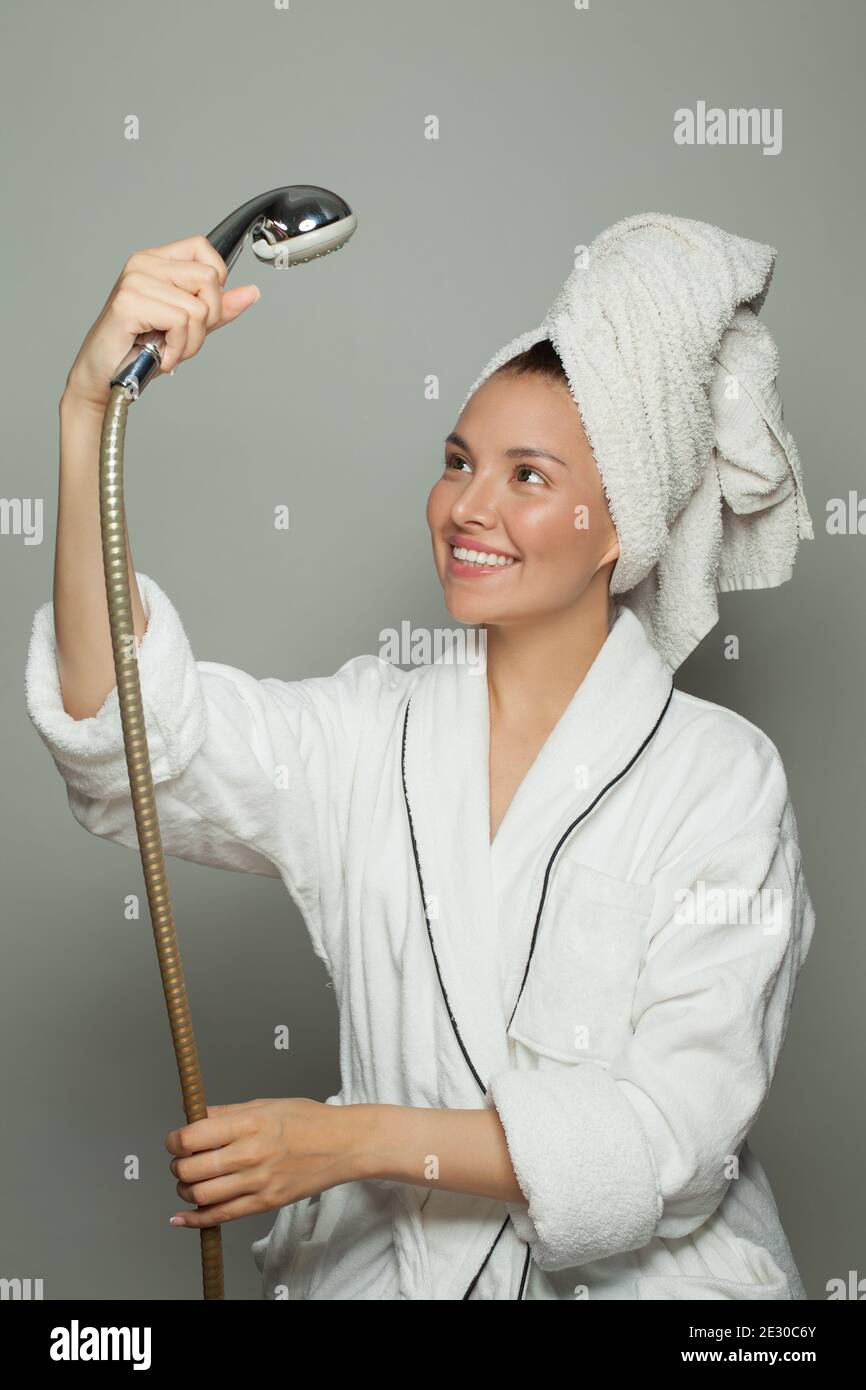 Bathrobe Routine Spa beauty woman in white bathrobe with shower, female routine Stock ...