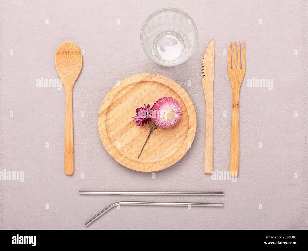 Zero waste, plastic free concept. Wooden plate, glass cup, Set of