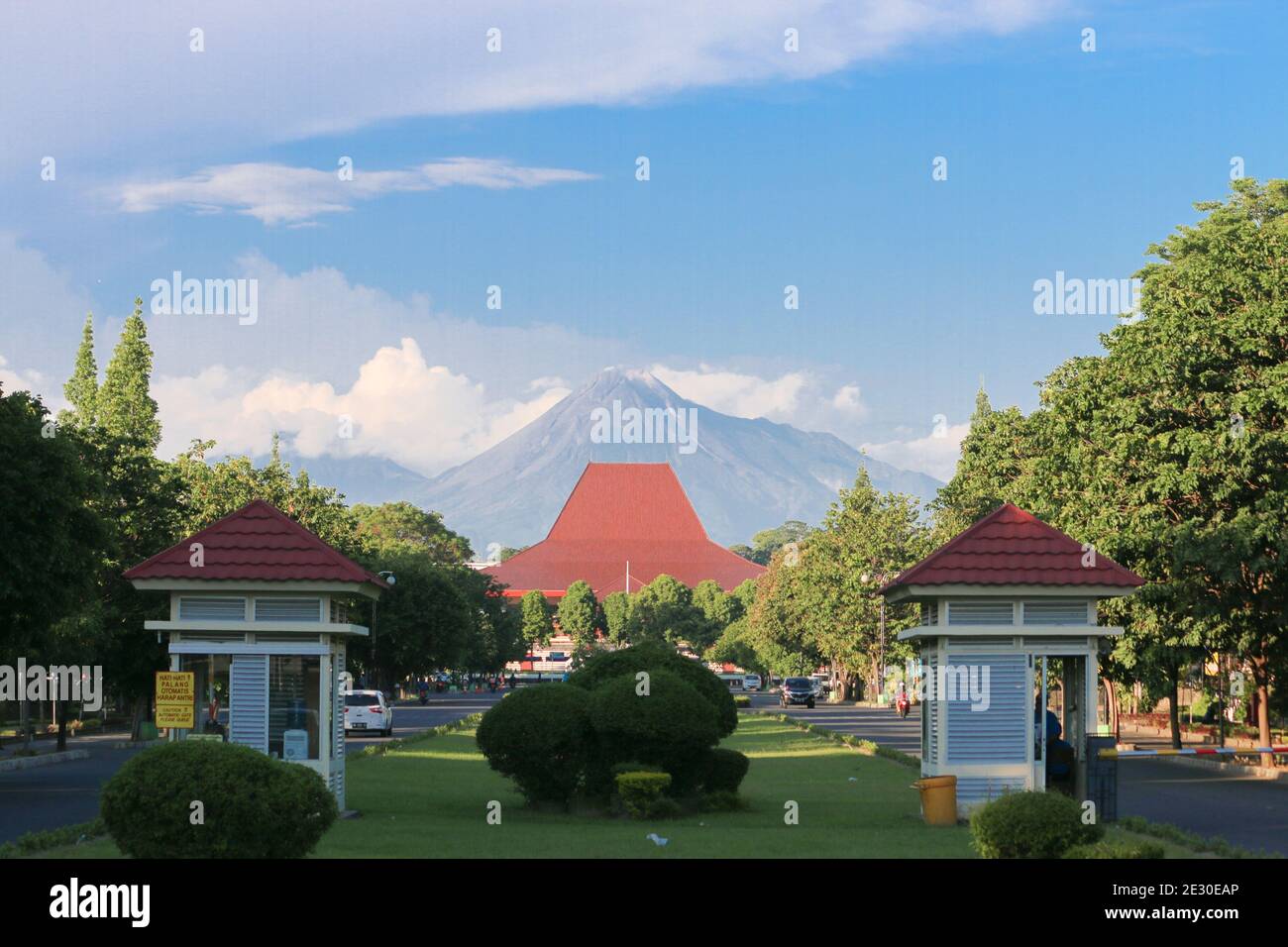 Yogyakarta, Indonesia - March 1, 2020: Gadjah Mada University front gate with Merapi mountain in the background. Stock Photo