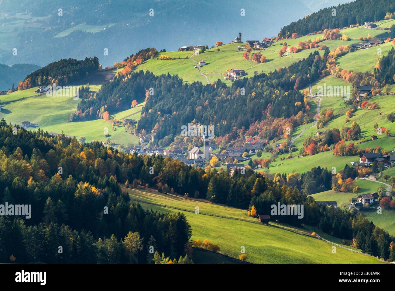 Autumnal view San Pietro and Funes valley. Funes Valley, Dolomites Alps, Trentino Alto Adige, Italy. Stock Photo