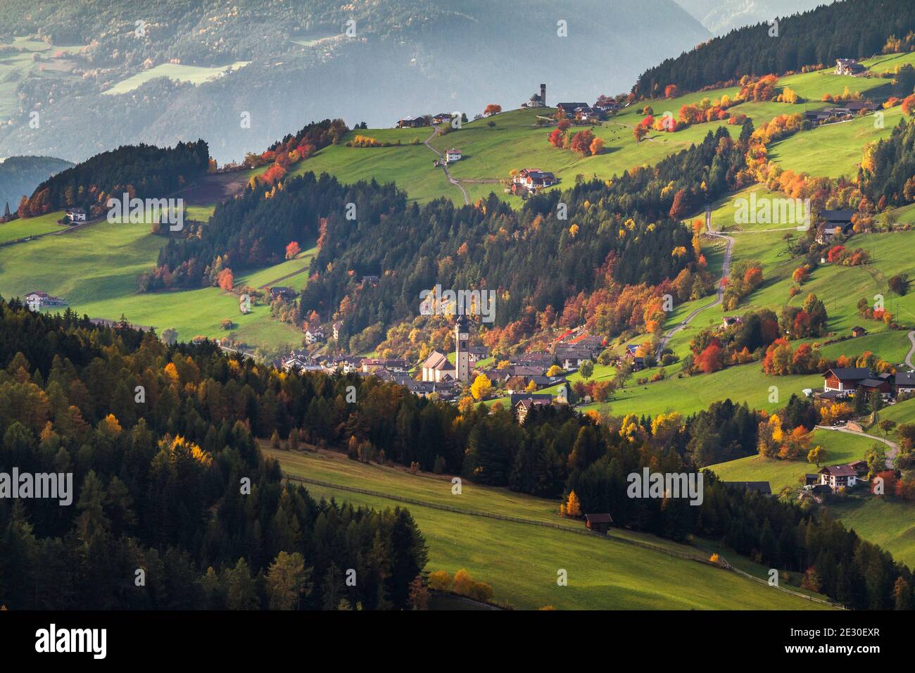 Autumnal view San Pietro and Funes valley. Funes Valley, Dolomites Alps, Trentino Alto Adige, Italy. Stock Photo
