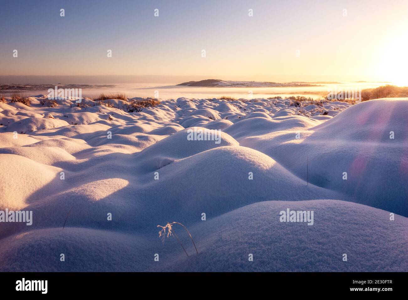 Stunning wintry weather conditions in the countryside - heavy snow in Wharfedale makes beautiful shapes on Burley Moor at sunrise. West Yorkshire, UK Stock Photo