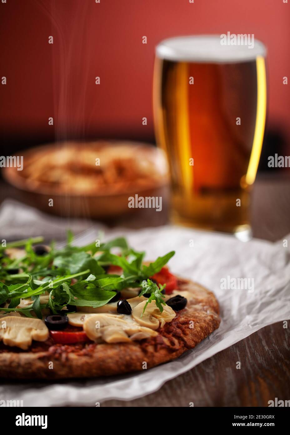 Pizza with Cheese, Tomatoes, Champignon, Olives and Arugola. Stock Photo