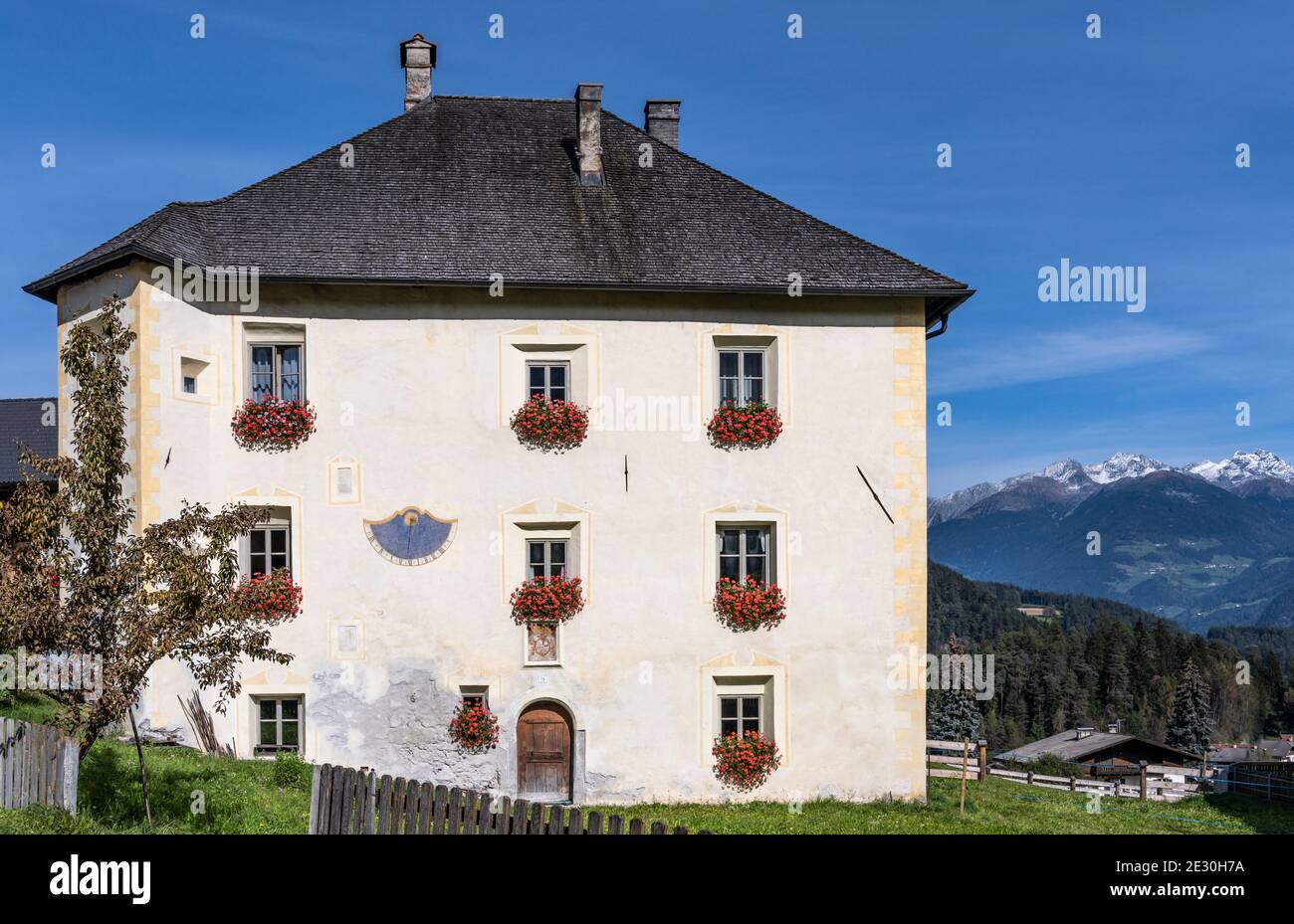 Farm and house with geraniums at the windows in Sankt Lorenzen Dolomites, Italy. Stock Photo