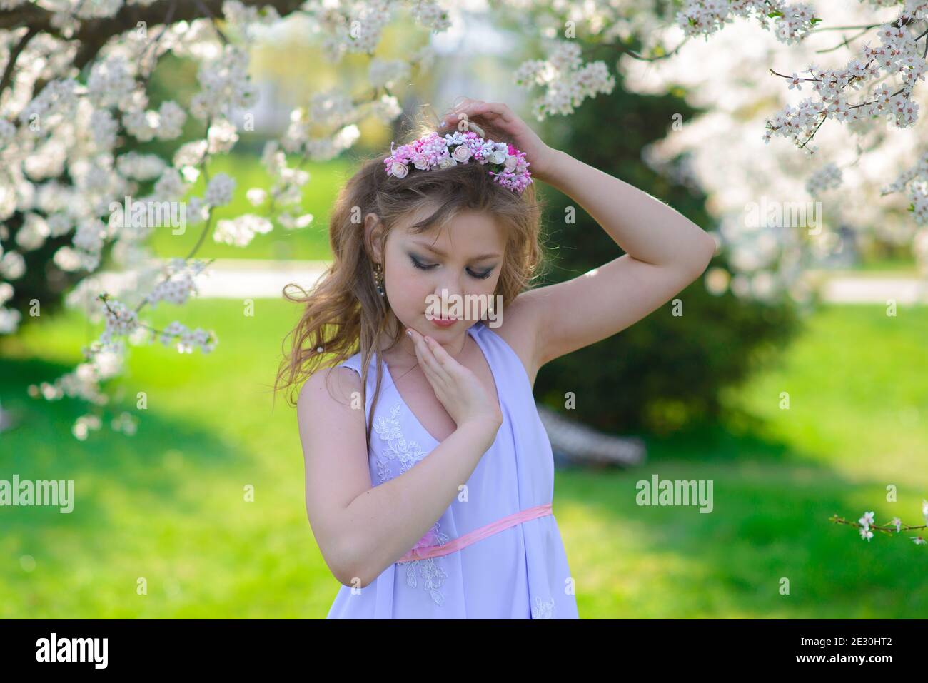 Pretty girl in blooming apple tree garden on beautiful spring day Stock ...