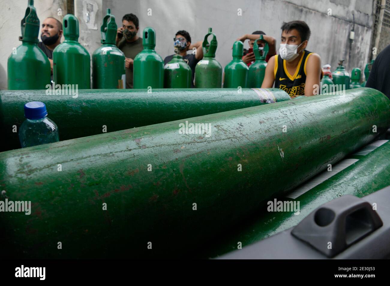 Manaus, Brazil. 15th Jan, 2021. People queue up to buy oxygen at an ...