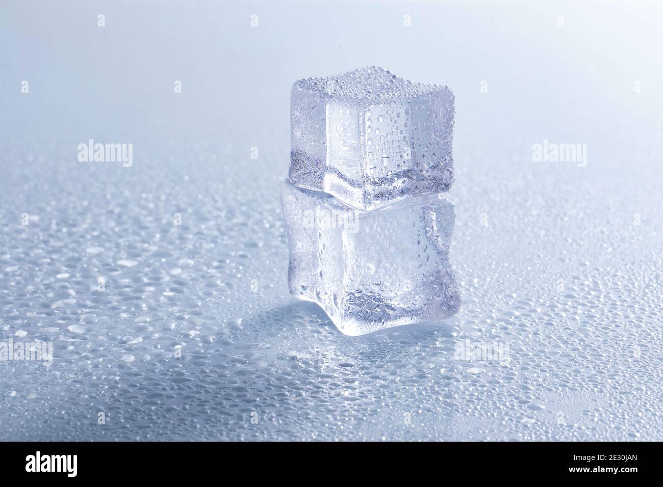 Selective focus shot of melting ice cubes on a wet surface Stock Photo ...