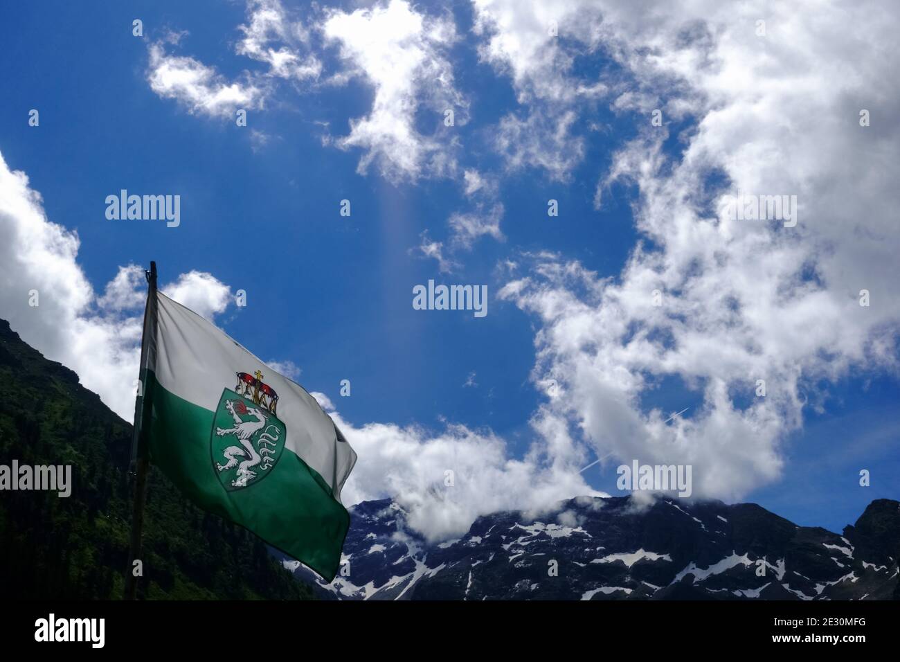 flag from styria in austria in the mountains while hiking in the summer ...