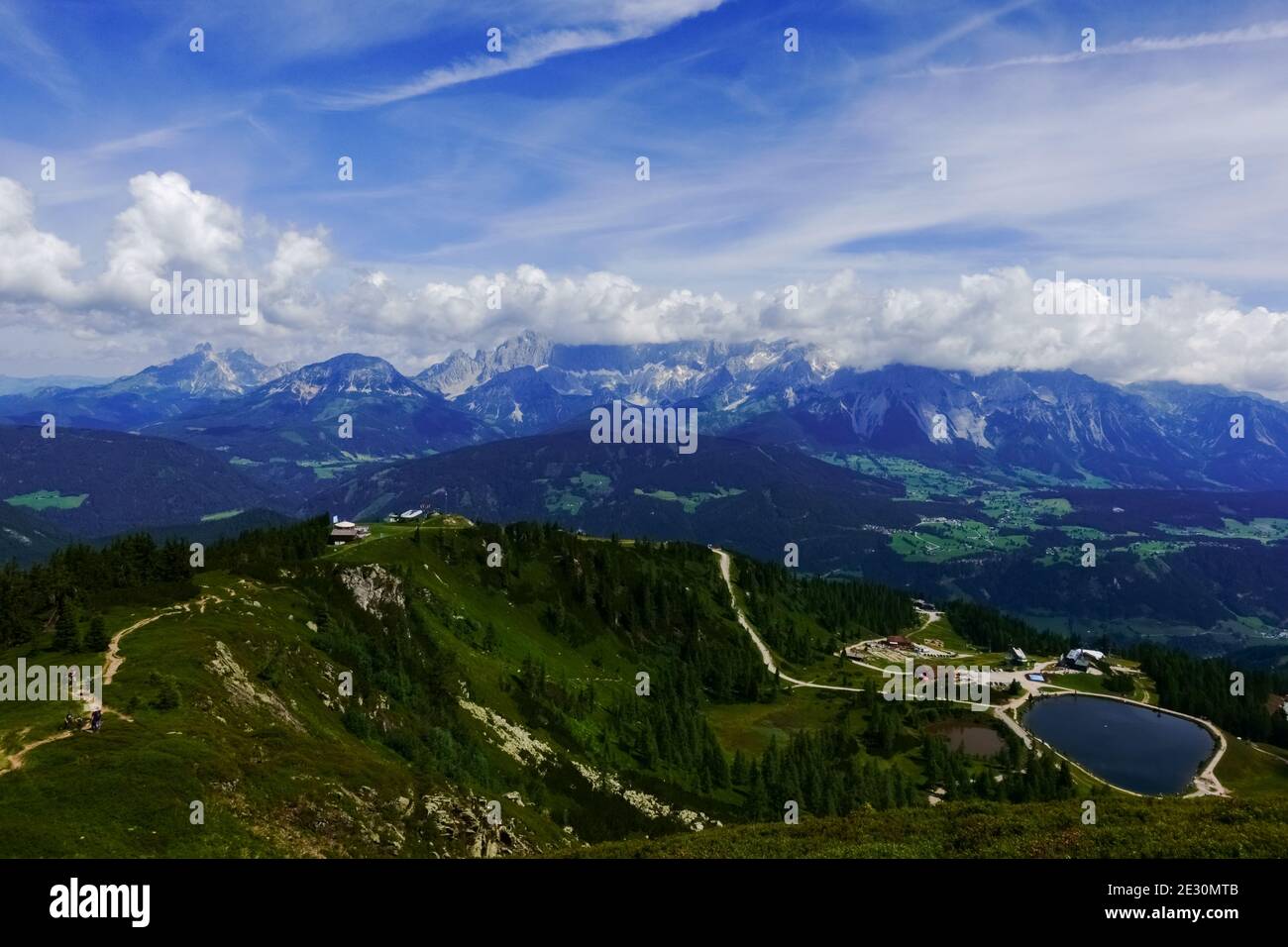 long path to a mountain lake while hiking in the summer on vacation ...