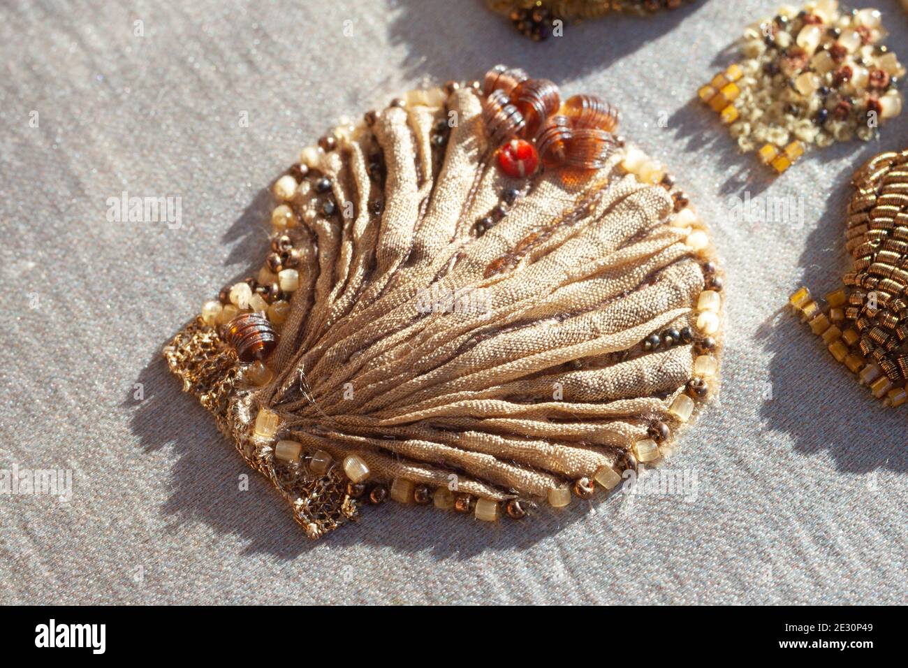 Couture embroidery of sea shells. Stock Photo