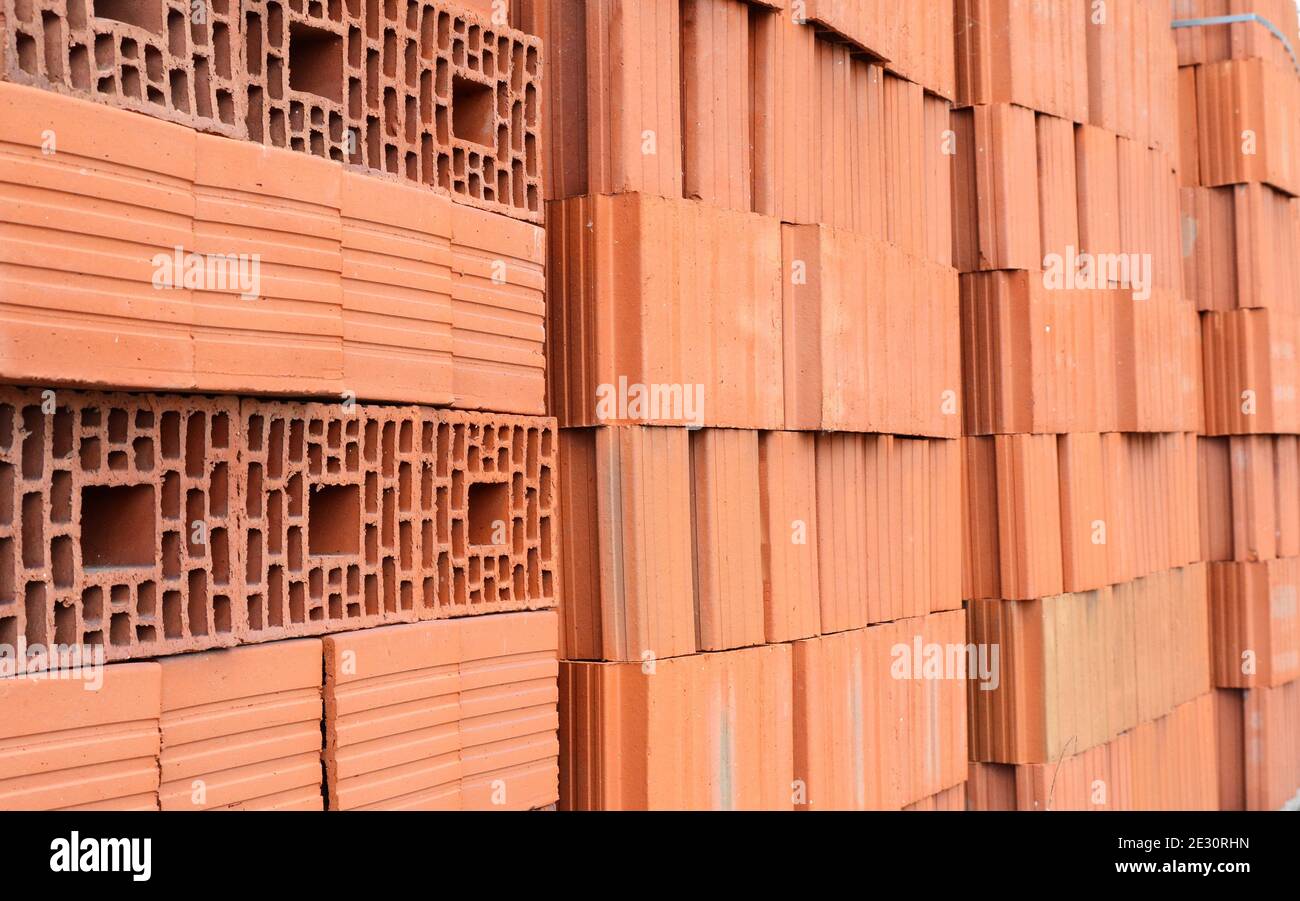 Wall blocks made from red porous ceramics with rectangular holes on a