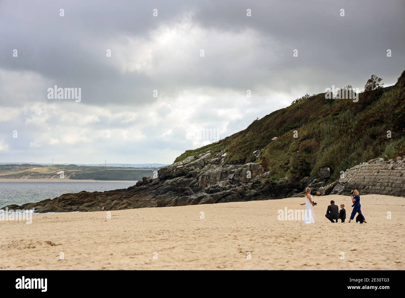 A near deserted Porthminster Beach in the Cornish town of St Ives provides a perfect setting for a wedding photographer to record a special day. The a Stock Photo