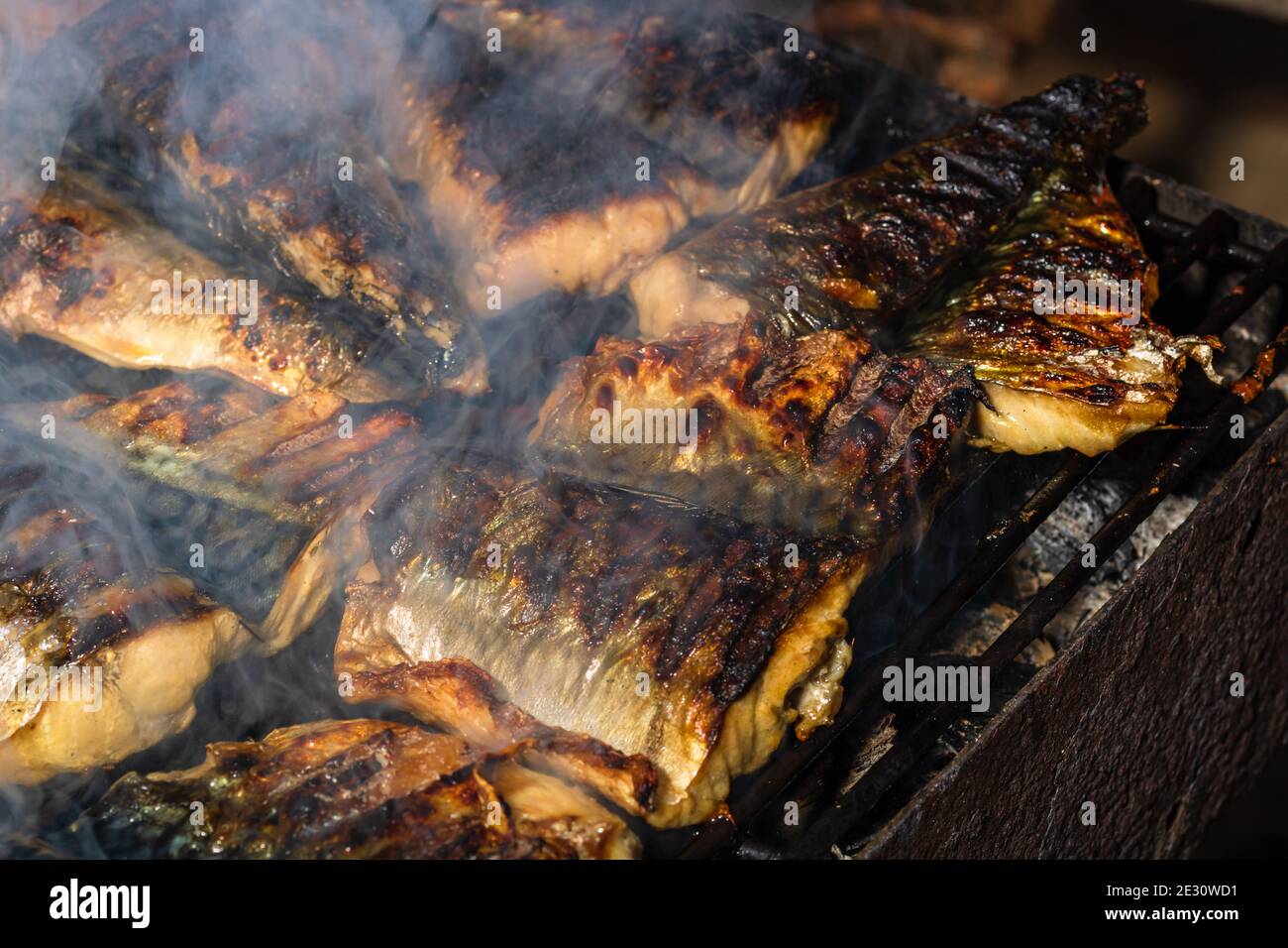 Grilled mackerel fish with smoke on a charcoal barbecue grill Stock Photo Alamy