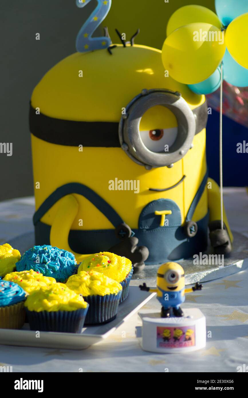 Minions Party Cake, kids birthday party ideas, yellow and blue minion, children 2 b-day party concept Stock Photo