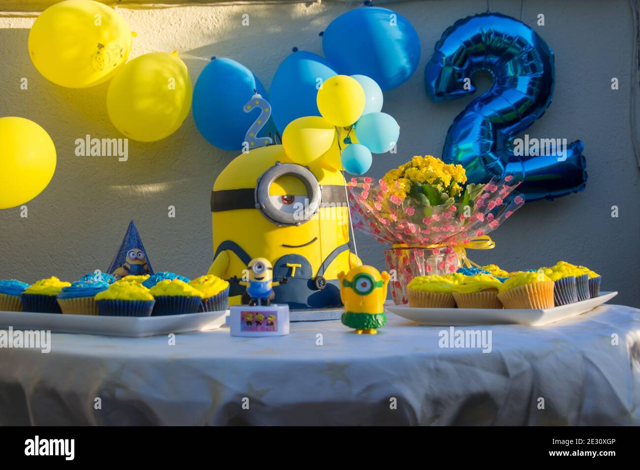 Minions Party Cake, kids birthday party ideas, yellow and blue minion, children 2 b-day party concept Stock Photo